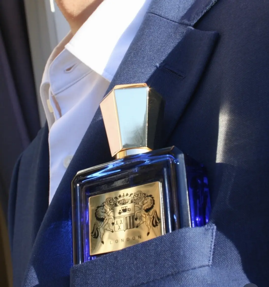 Sartoria Extrait de Parfum held in the breast pocket of a tailored jacket